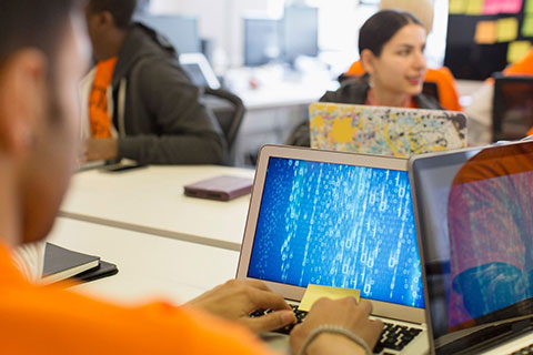 KCOM hackathon participants on laptops