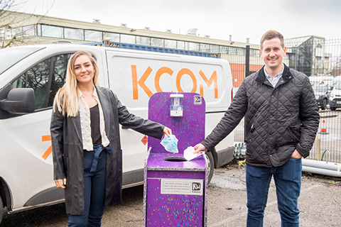 ReWorked's Izzie Glazzard and KCOM's Mark Blenkinsop with the PPE recycling bin