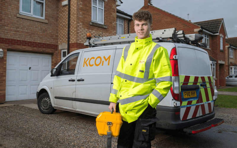 Engineer outside his van, down a residental area.