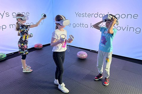 Reel Creative Community grant recipients using VR headset