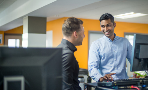 Two KCOM employees chatting