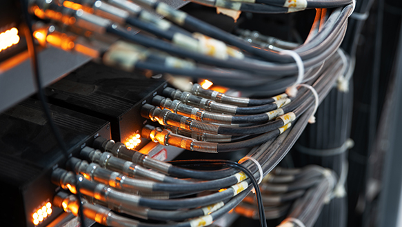 Network cables, intricately connected and extending to provide reliable internet access to valued customers, highlighting the seamless connectivity and service provided by the network infrastructure.