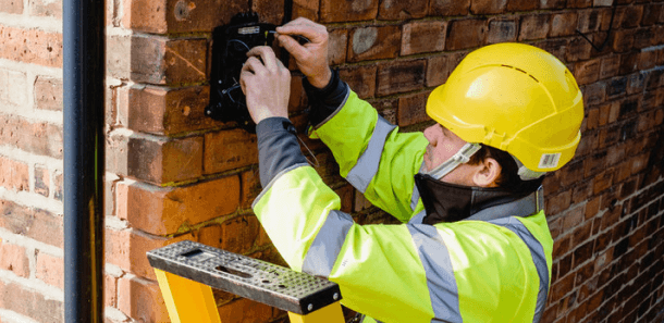 KCOM engineer installing fibre broadband on house