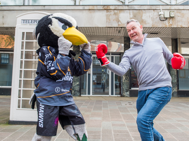 KCOM MD Neil Bartholomew takes on Sammy The Seahawk