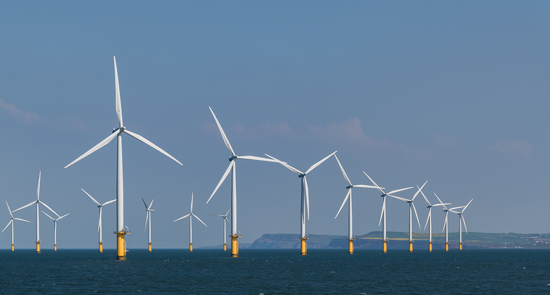 Image shows an wind farm on the ocean