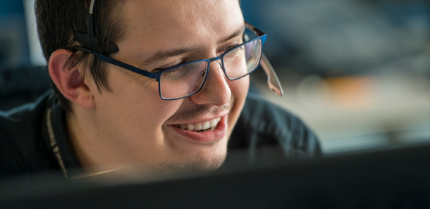KCOM employee working at desk