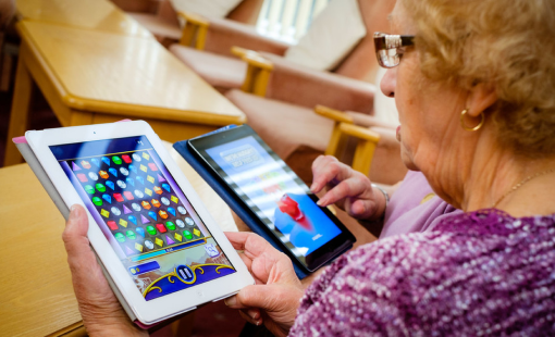 Older lady playing game on iPad