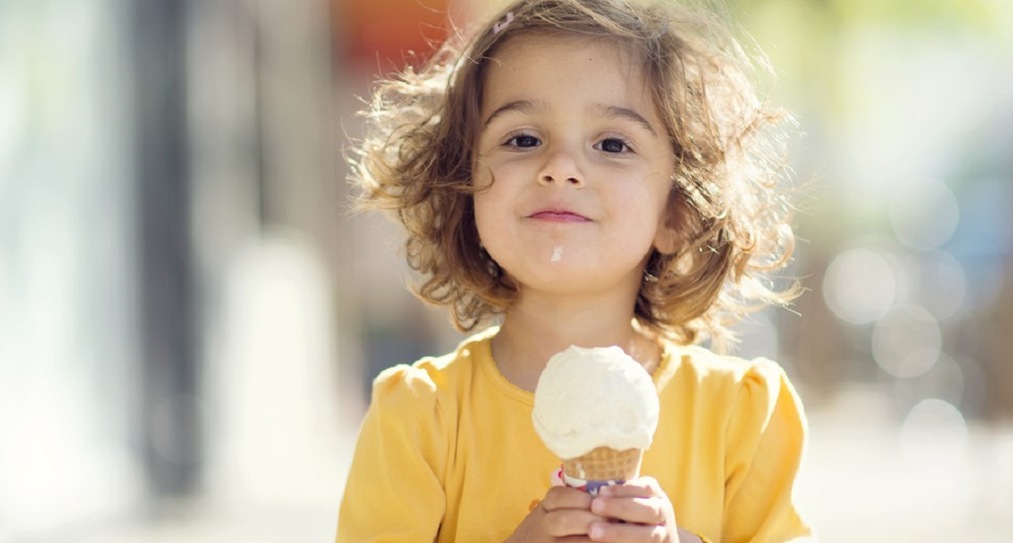 Young girl eating an ice cream cone