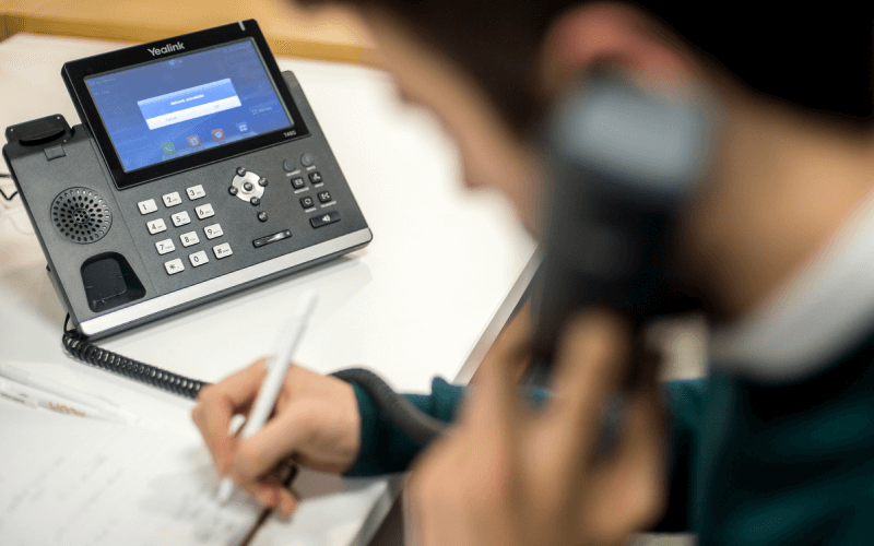 KCOM employee using telephone