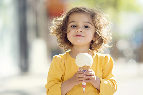 Young girl eating an ice cream cone