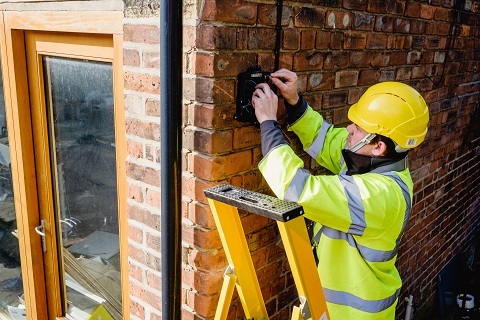 Engineer installing fibre