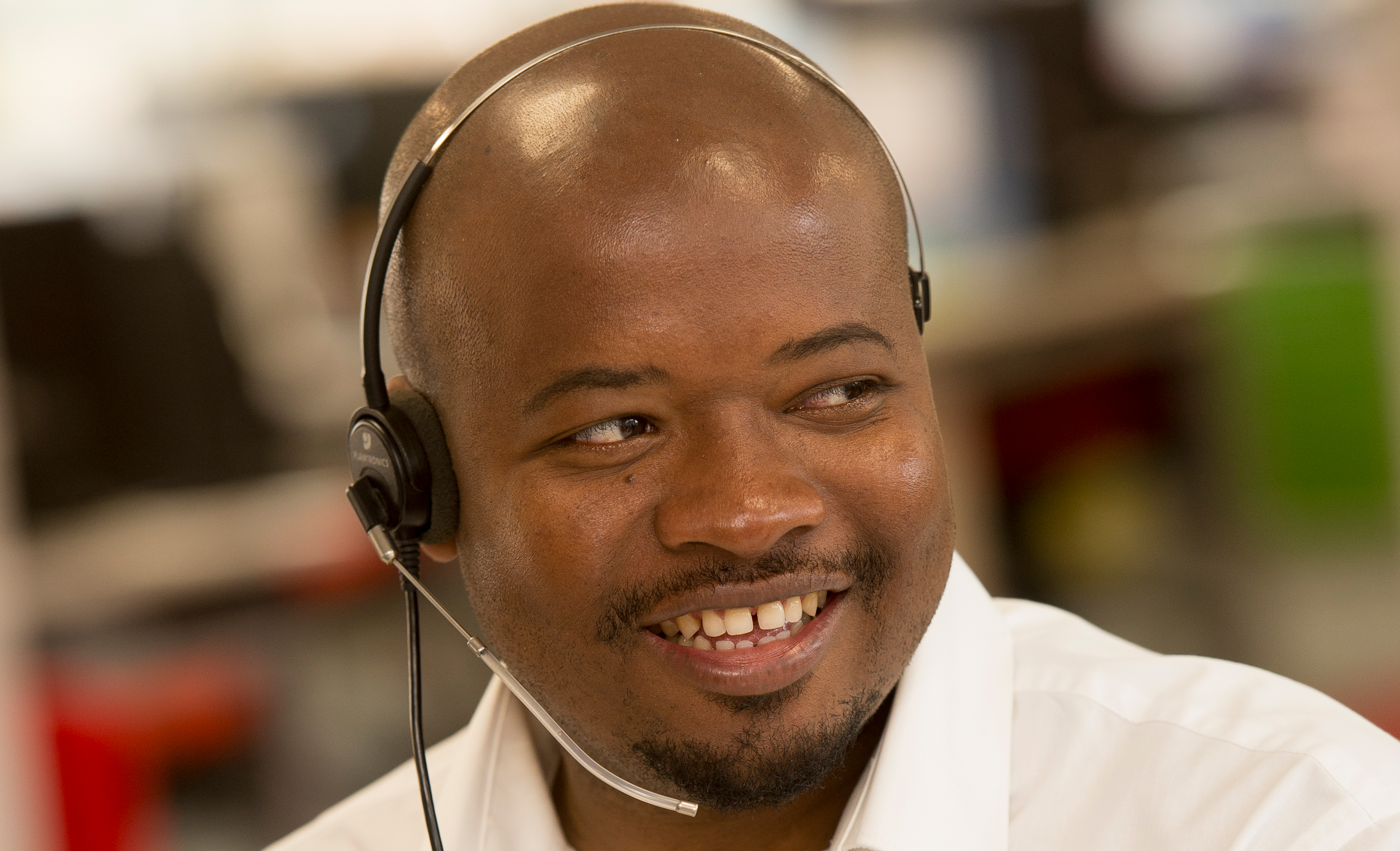 KCOM employee talking on headset