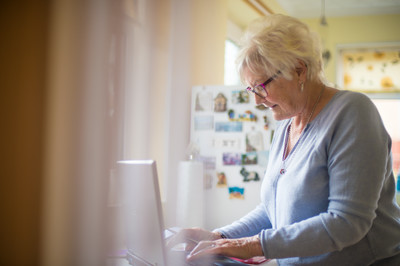 Lady using laptop at home