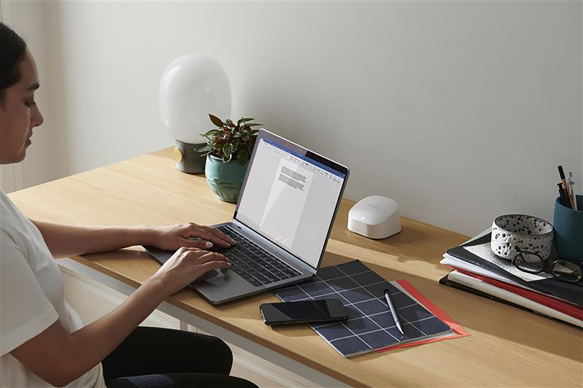 eero 6+ router on working desk