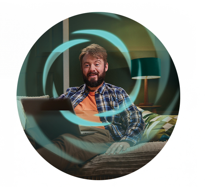 A man with laptop in his living room.
