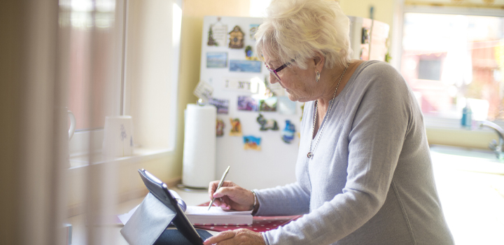Elderly woman using iPad